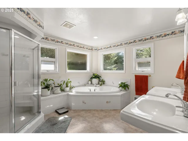 a bathroom with a sink mirror and a bathtub