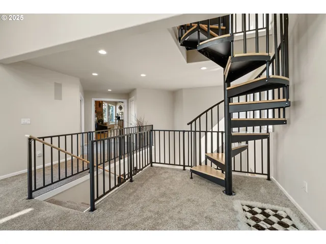 a view of a livingroom with furniture and floor to ceiling window