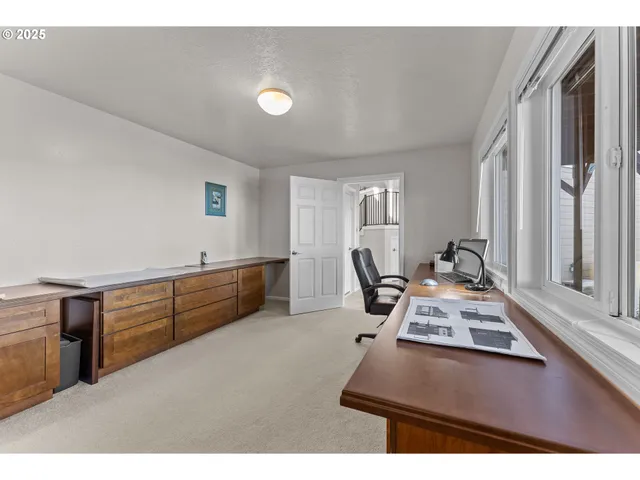 a utility room with cabinets washer and dryer