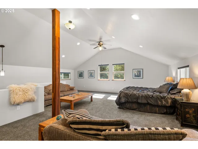 a bedroom with furniture and a lamp