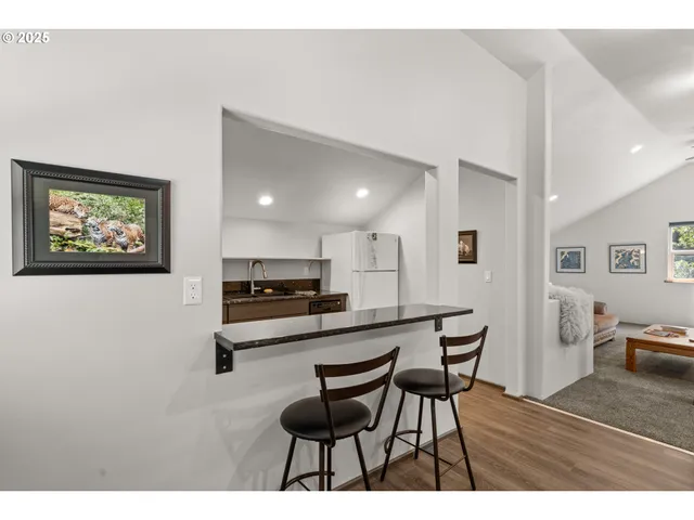 a kitchen with stainless steel appliances granite countertop a stove sink and cabinets