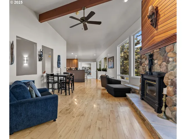 a living room with furniture and fireplace