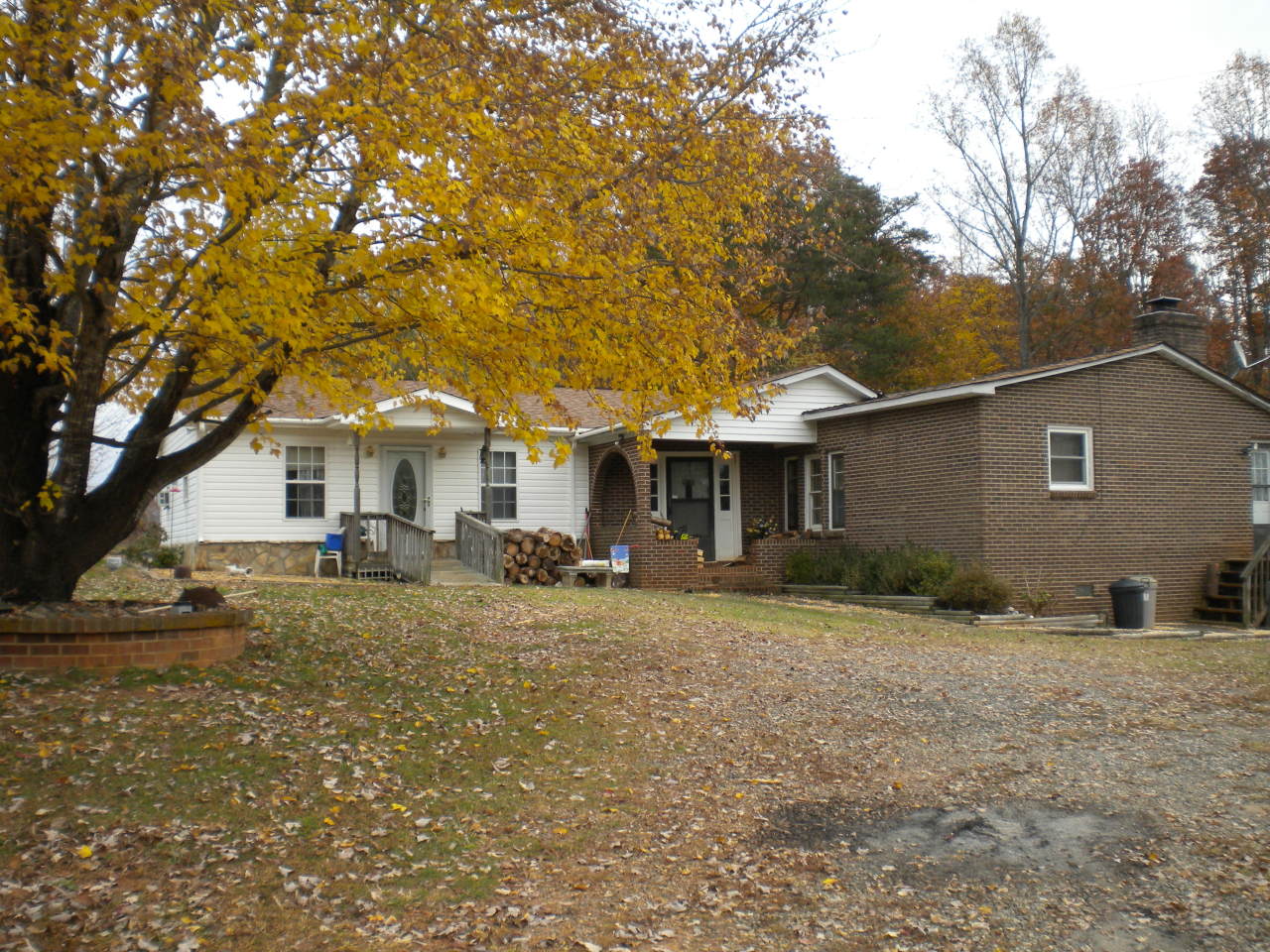 2284 Virginia Nc Road Spencer, VA 24165 - Photo 1 of 9 a front view of a house with garden