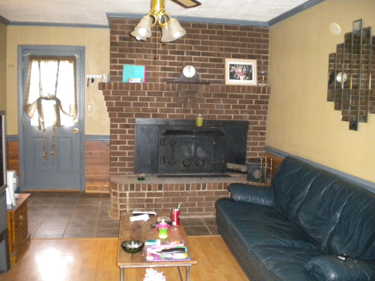 2284 Virginia Nc Road Spencer, VA 24165 - Photo 7 of 9 a living room with furniture a flat screen tv and a fireplace