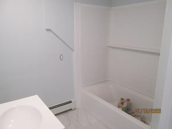 a bathroom with a sink and vanity