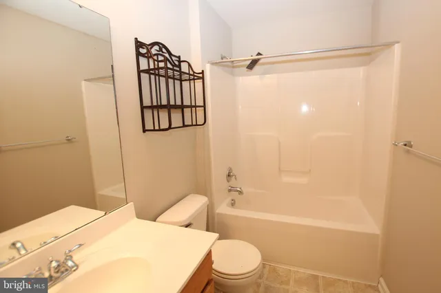 a bathroom with a toilet and shower