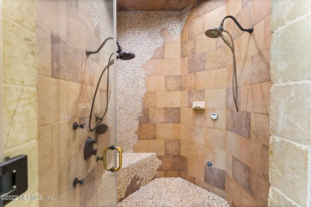 a bathroom with a bathtub and a shower