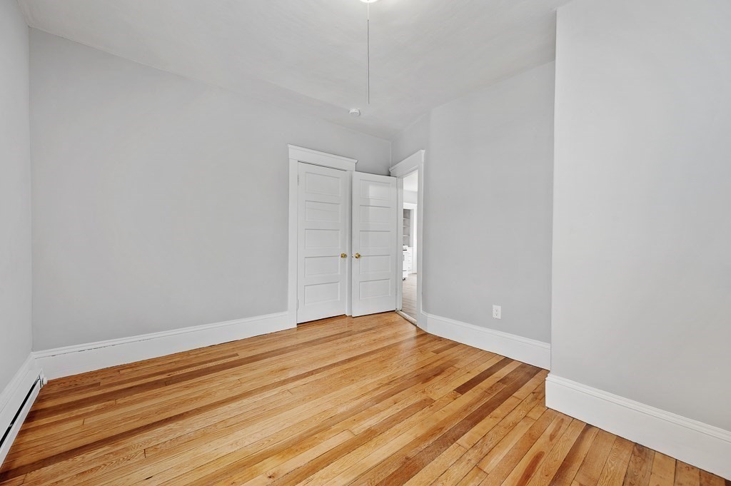 256 Belmont Street Worcester, MA 01604 - Photo 20 of 40 a view of room with wooden floor