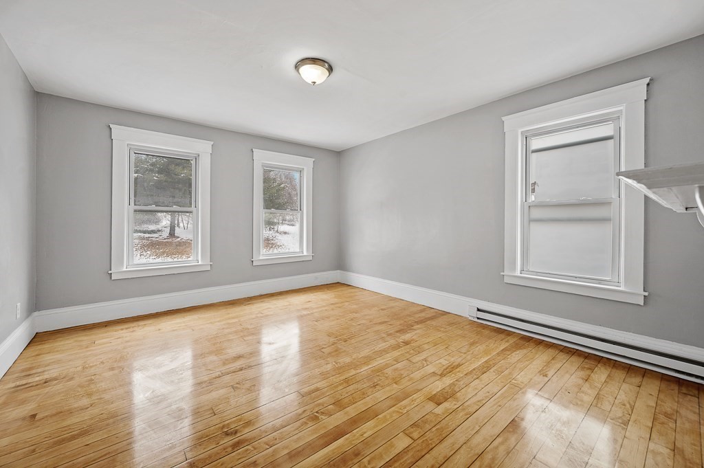 256 Belmont Street Worcester, MA 01604 - Photo 40 of 40 a view of an empty room with wooden floor and a window