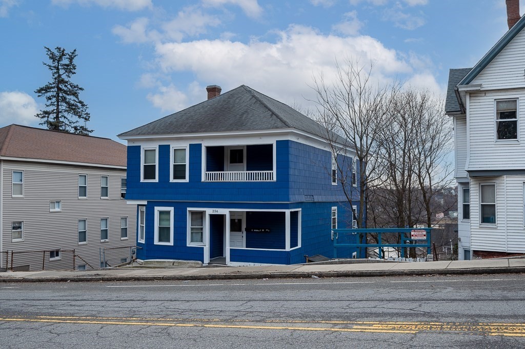 256 Belmont Street Worcester, MA 01604 - Photo 4 of 40 a front view of a house with a yard