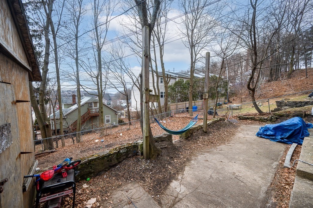 256 Belmont Street Worcester, MA 01604 - Photo 8 of 40 a backyard of a house with barbeque oven and table