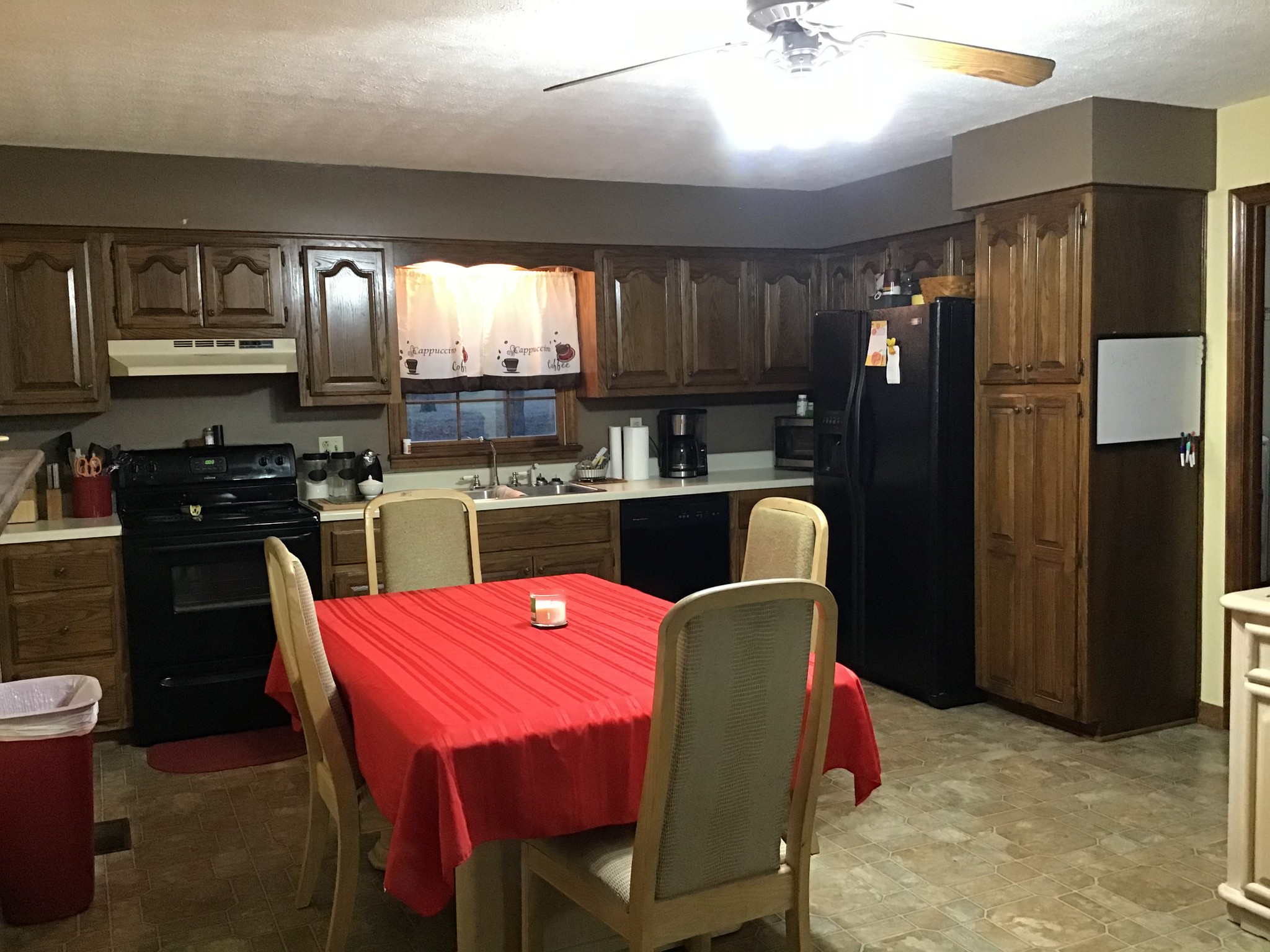 6830 Hester Road Springfield, TN 37172 - Photo 6 of 28 a kitchen with stainless steel appliances granite countertop a stove refrigerator a sink dishwasher with a dining table and chair