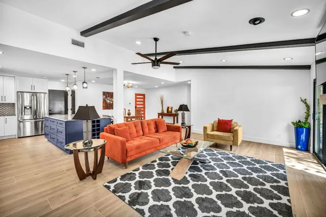 a living room with furniture and a table
