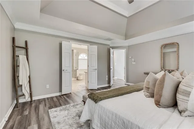 a bedroom with a bed and a walk in closet