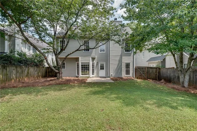 a backyard of a house with seating space
