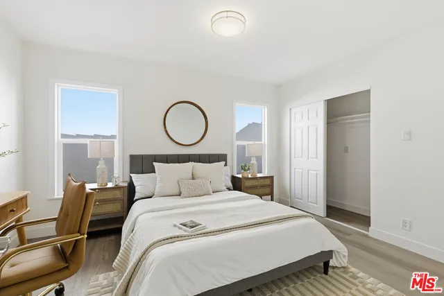 a bathroom with a shower sink vanity mirror and toilet