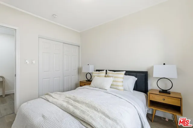 a bedroom with a bed and a couch