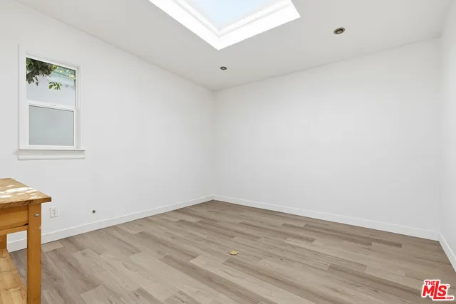 an aerial view of a house with a garden