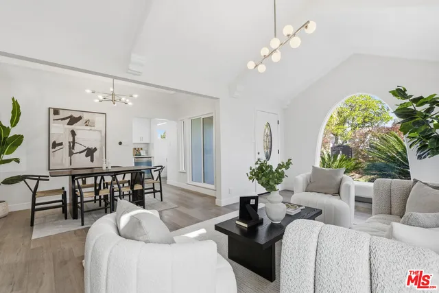 a kitchen with kitchen island white cabinets sink and white appliances