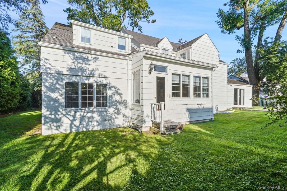 246 Mamaroneck Road Scarsdale, NY 10583 - Photo 35 of 35 Rear view of the house with a yard
