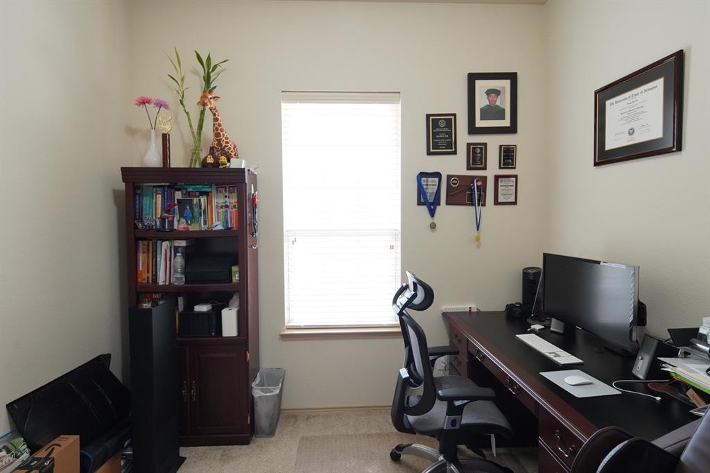 4508 Fox Rio Trail Arlington, TX 76017 - Photo 20 of 28 a view of a workspace with furniture and a window