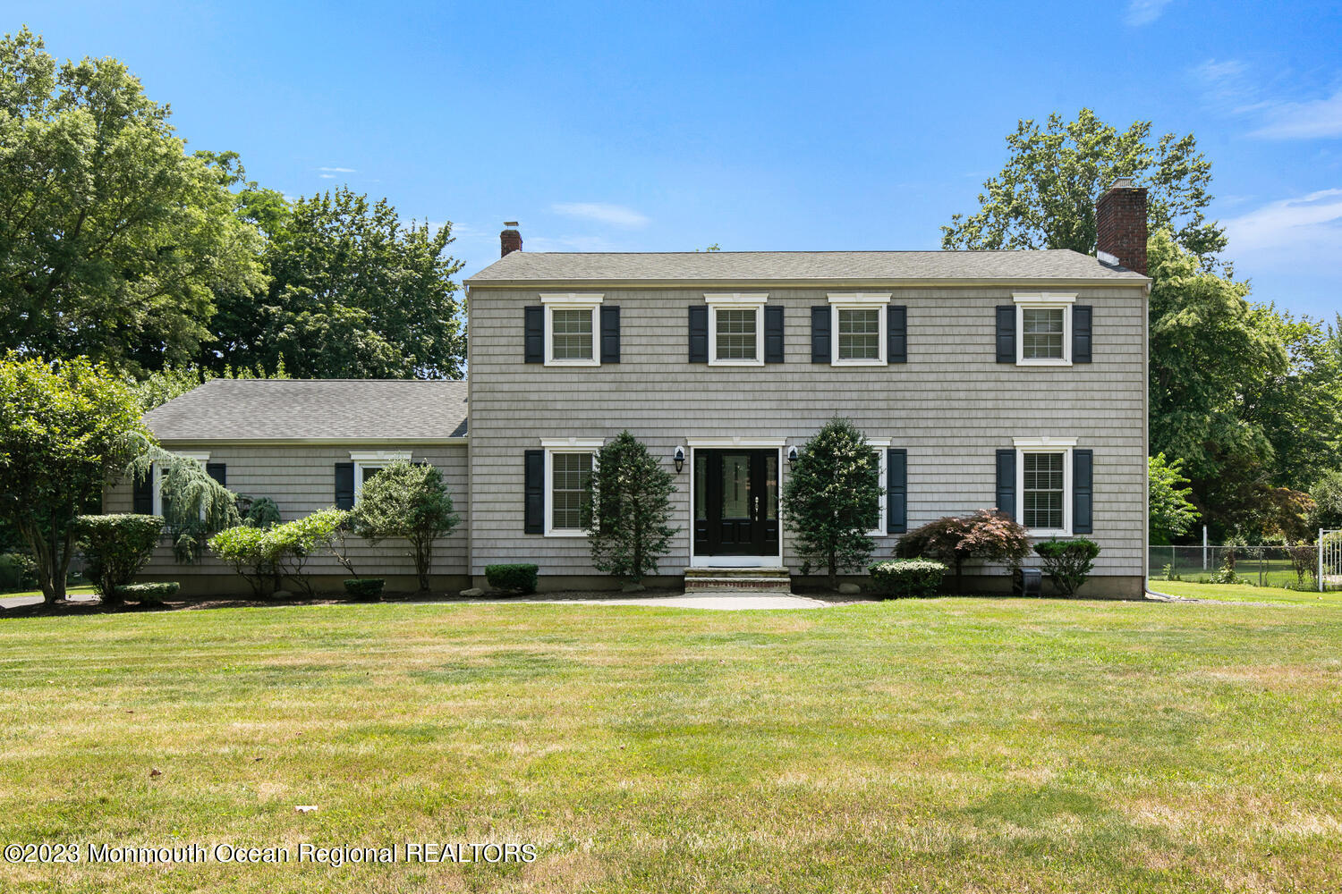 383 Oak Hill Road Red Bank, NJ 07701 - Photo 1 of 31 a front view of house with yard and trees around