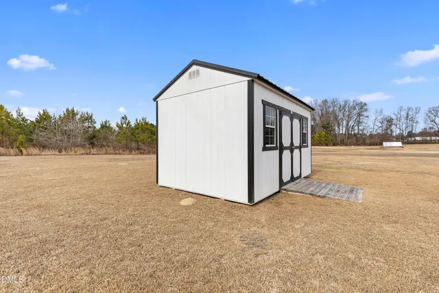 a view of a garage with parked cars