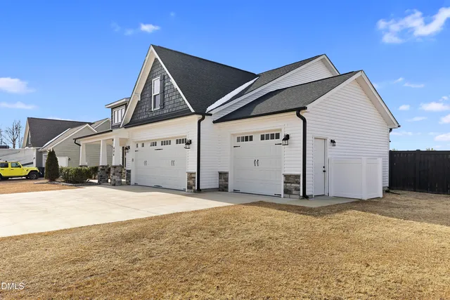 a bathroom with a sink vanity and a toilet