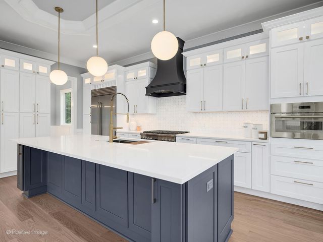 a kitchen with cabinets and white appliances
