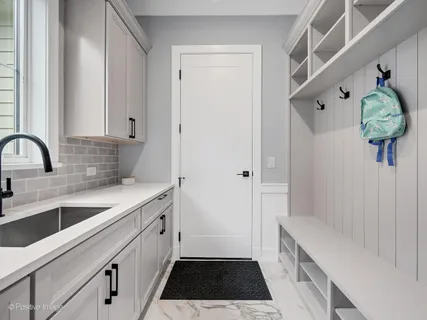 a kitchen with a sink and a refrigerator
