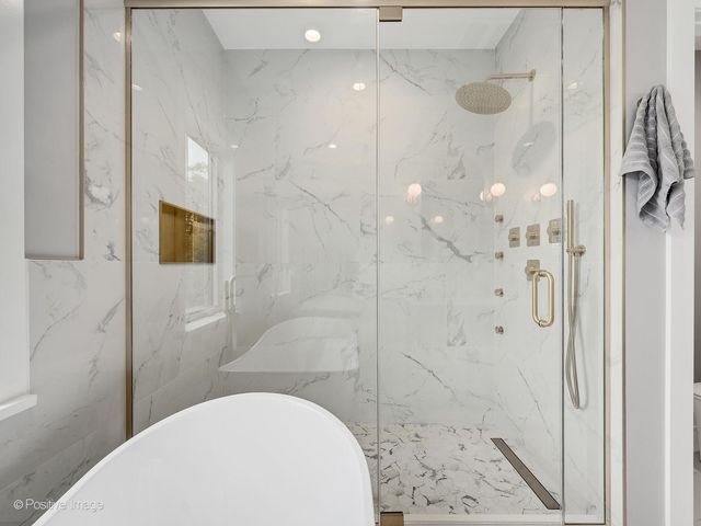 a bathroom with a sink and shower