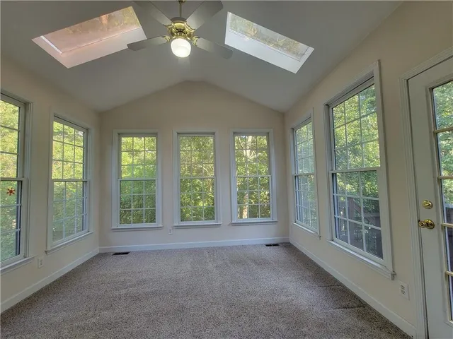 a view of a room with a large window