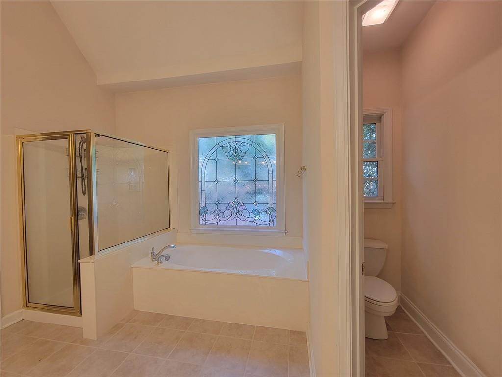 6330 Olde Atlanta Parkway Suwanee, GA 30024 - Photo 20 of 31 a bathroom with a bathtub and a shower