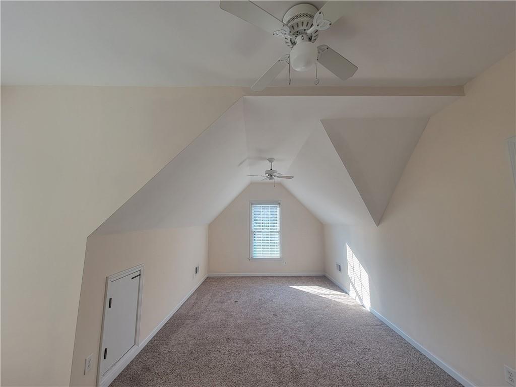 6330 Olde Atlanta Parkway Suwanee, GA 30024 - Photo 22 of 31 a view of a hallway with windows and chandelier fan