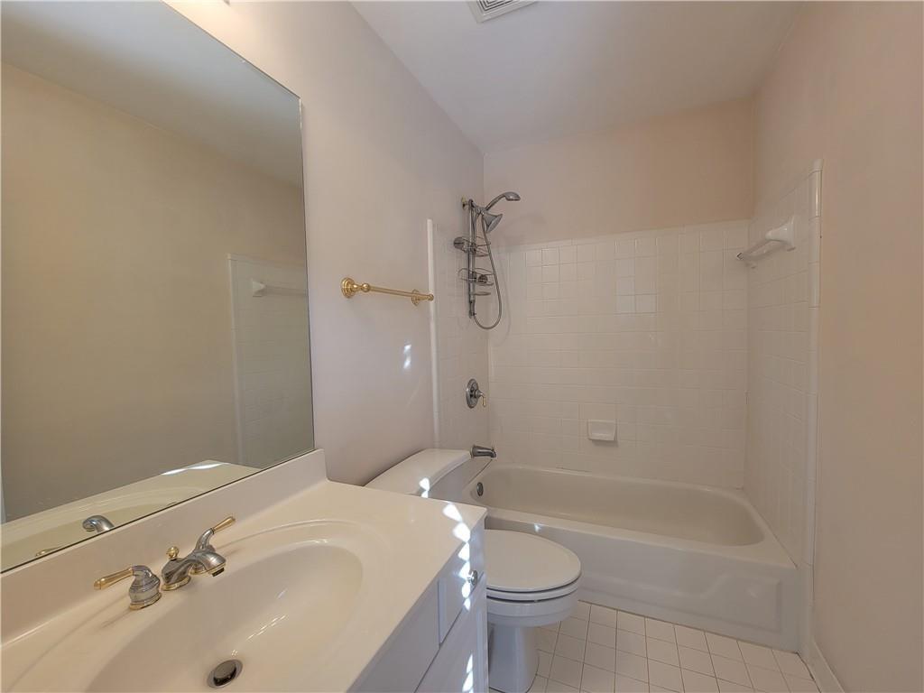 6330 Olde Atlanta Parkway Suwanee, GA 30024 - Photo 23 of 31 a bathroom with a sink a toilet and shower
