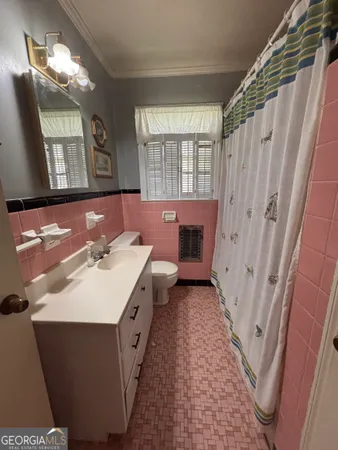 a bathroom with a sink a mirror and a shower