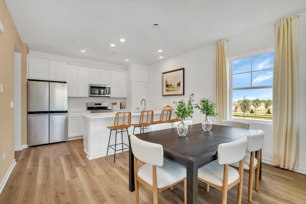 2136 Bodega Road Oswego, IL 60543 - Photo 6 of 22 a view of a dining room with furniture and wooden floor