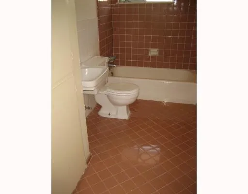 a bathroom with a toilet and a bathtub