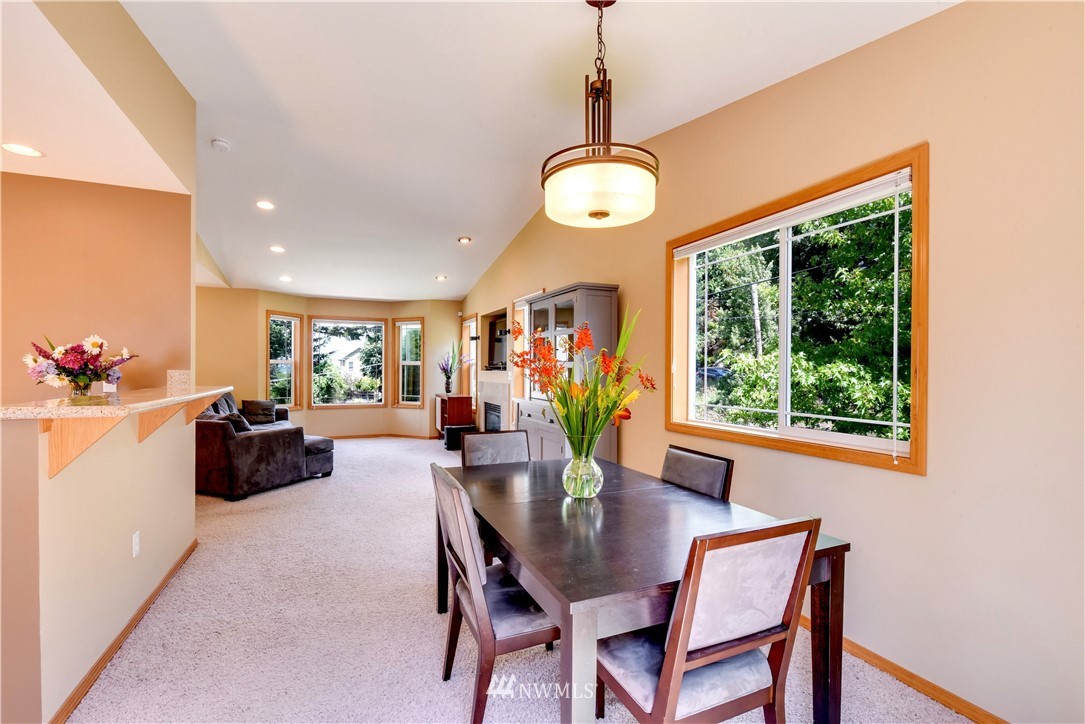 5317 Renton Avenue South Seattle, WA 98118 - Photo 3 of 20 a dining room filled chandelier and wooden floor