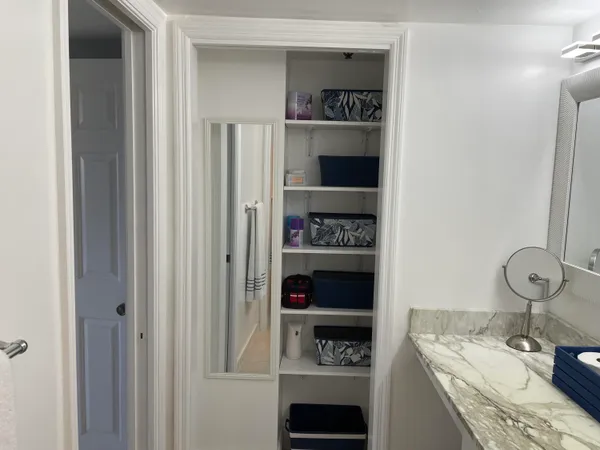 a bathroom with a sink toilet and mirror