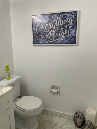a view of swimming pool with a garden and palm trees