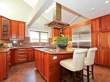 a kitchen with stainless steel appliances granite countertop a stove a sink dishwasher and cabinets