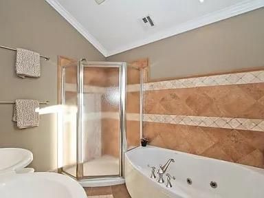 a bathroom with a bathtub and a toilet