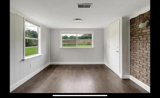 an empty room with windows