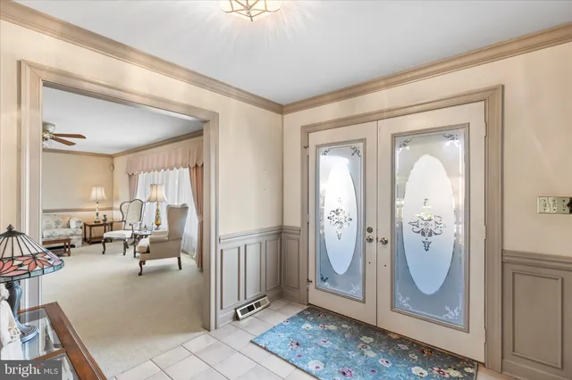 a living room with furniture flowerpot and a window