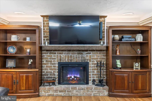 a dining room with furniture and a large window