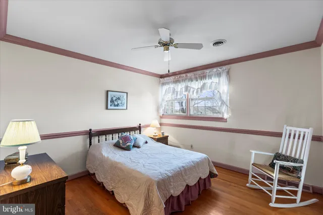 a view of bathroom with a toilet sink and mirror