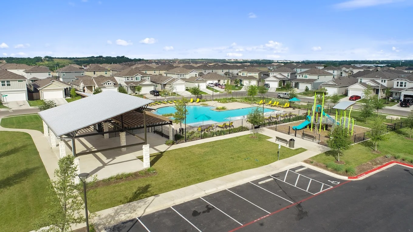 10700 Sentinel Drive Austin, TX 78747 - Photo 26 of 28 Community amenity center with pool and playscape.