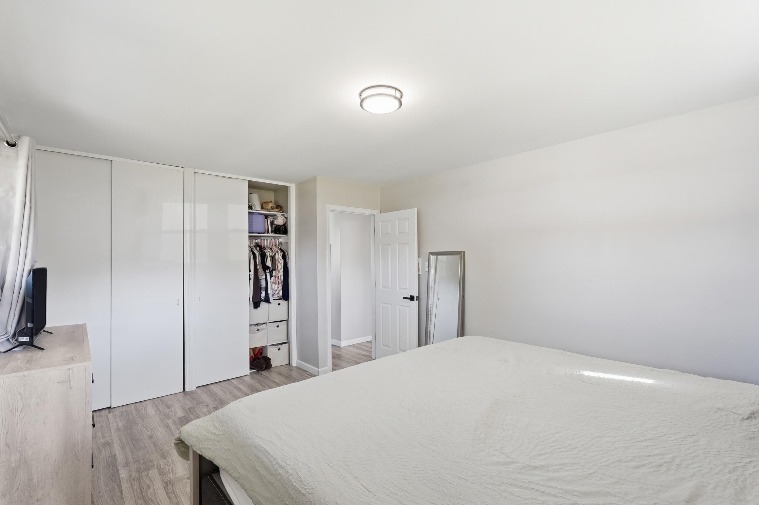 3737 Fillmore Street Gary, IN 46408 - Photo 13 of 19 a bedroom with a bed and a flat screen tv