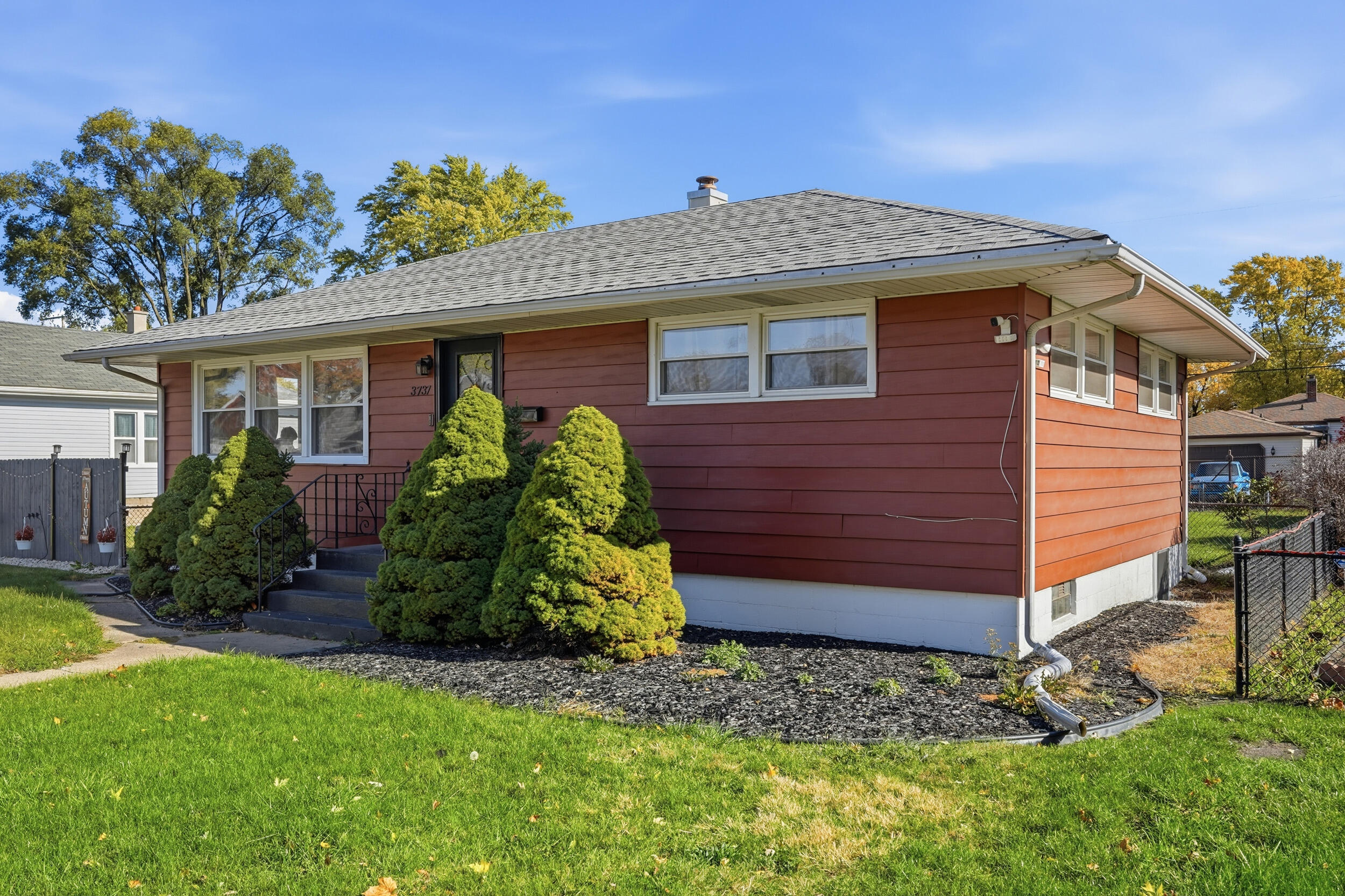 3737 Fillmore Street Gary, IN 46408 - Photo 2 of 19 a front view of a house with garden